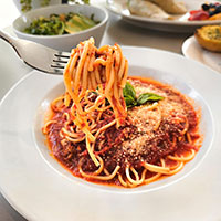 Pasta in a plate and on a fork