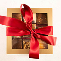 A box of chocolates with a ribbon on it