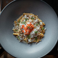 Bowl of pasta with Parmesan cheese on top