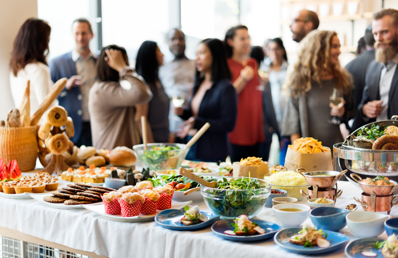 Picture of food platters on a table during a corporate party.