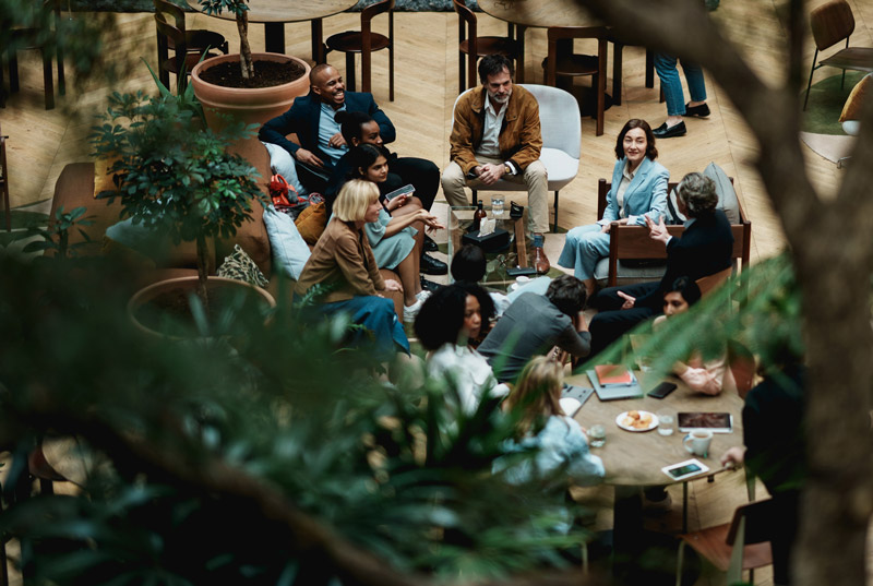 Group of business diners socializing at a restaurant